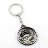 Round metal keychain with dragonKeyrings