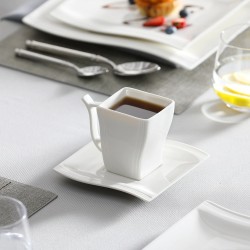 Elegant tableware - white porcelain dinner set - cups - saucers - platesCutlery