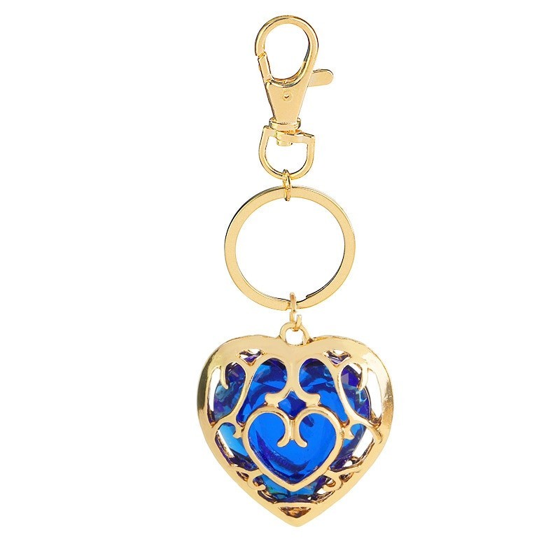 Crystal heart in golden cage - keychainKeyrings
